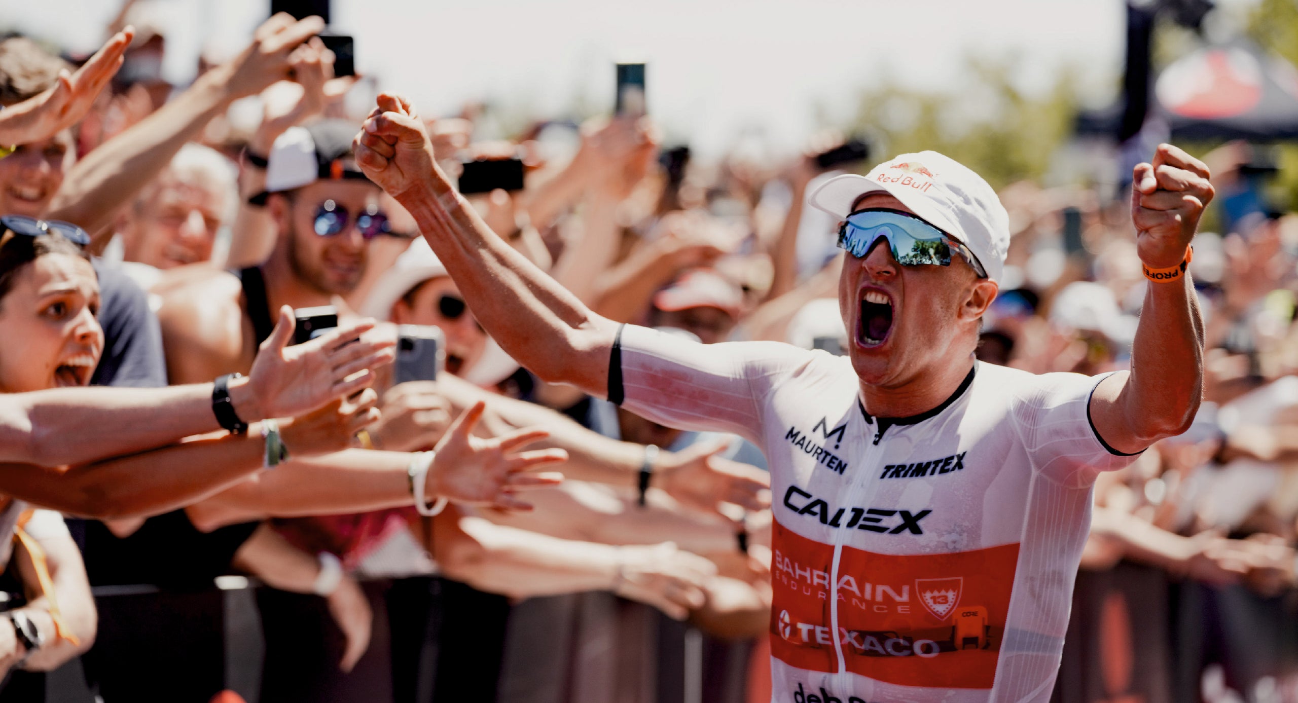 Kristian Blummenfelt winning the Ironman World championship in St. George wearing his Trimtex triathlon suit