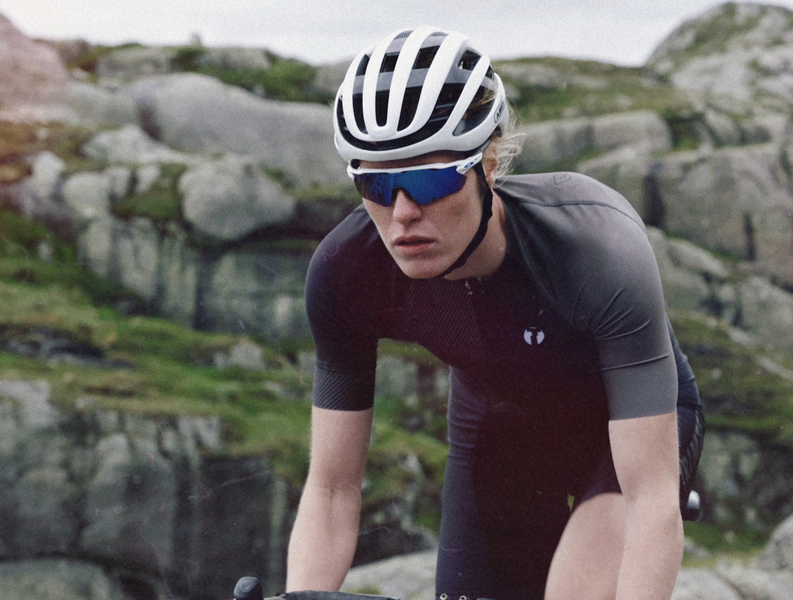 Triathlete biking in Trimtex Drive triathlon suit in the Nordic Grit