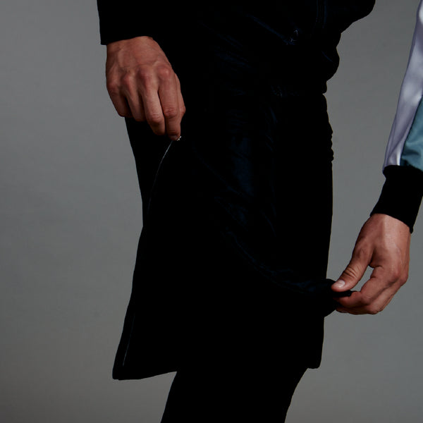 Studio photo of man in Trimtex Pulse Shorts, showing that the zipper is reaching up to the upper thigh.