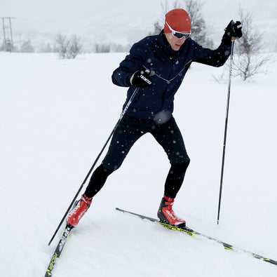 Man skiing, wearing Trimtex Pulse Jacket, Shorts and Tights.
