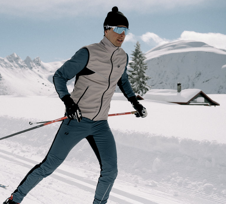 Man skiing at ski tracks, wearing Trimtex Pulse Vest, Jacket and Pants.
