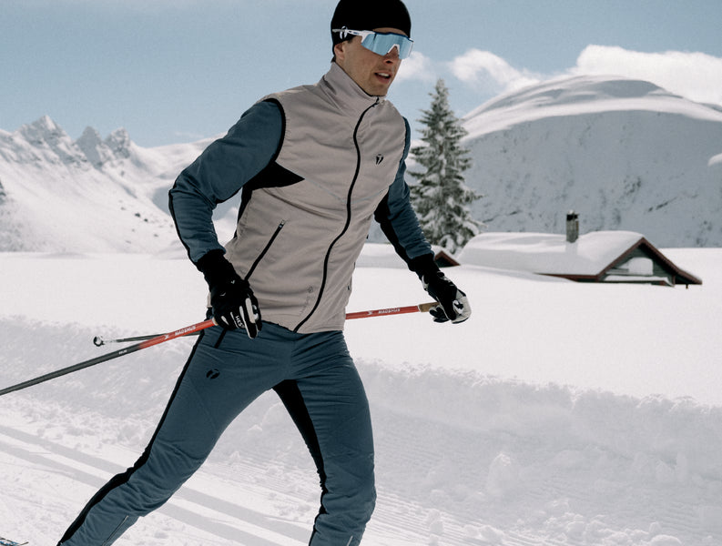Man skiing at ski tracks, wearing Trimtex Pulse Vest, Jacket and Pants.