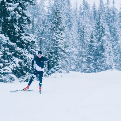 A man skiing in his custom made Ambition Racesuit from Trimtex