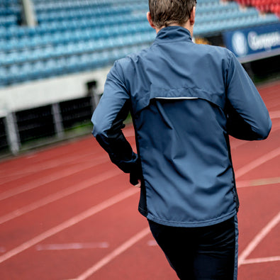 Back shot of triathlete Kristian Blummenfelt Trimtex Trainer jacket