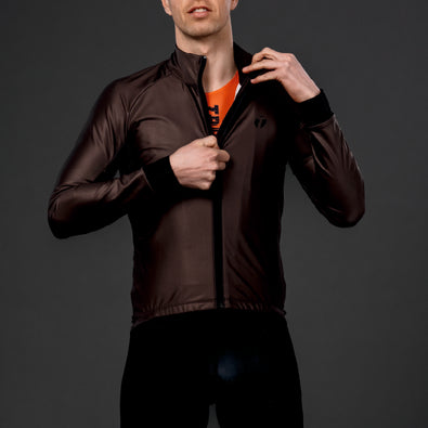 Trimtex triathlete wearing Venom cycling jacket in brown.